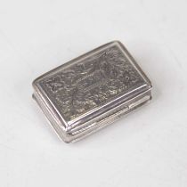 A George III silver vinaigrette, of hinged rectangular form, having floral engraved decorated and