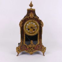 A late 19th century French boule-work mantel clock, the gilt metal dial having enamel cartouches