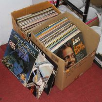 A collection of 12" vinyl records to include Peggy Lee - I'm a Woman, Nat King Cole - Sings