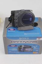 A Sony DCR-DVD 101E digital video camera, boxed with charger, remote control, and instruction manual