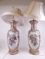A pair of large Chinese export vases, each of shouldered baluster form, enamel decorated with