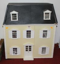 A modern dolls house in the style of a Georgian mansion, having hinged roof and hinged front,