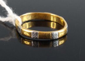 A 22ct gold and platinum wedding band, 2.6g (misshapen)