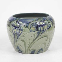 William Moorcroft for Liberty & Co - a squat circular vase, tube-line decorated in the Florian Poppy