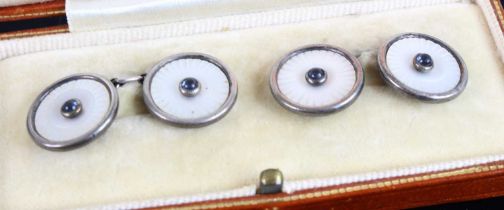 A cased pair of sterling silver mother of pearl and blue paste set gent's cufflinks, the case