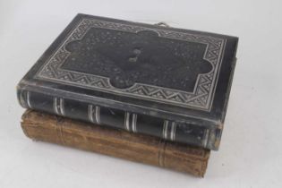 A Victorian embossed black leather photograph album, contents to include portraits; together with