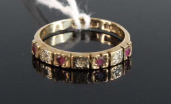 A modern 9ct gold ruby and diamond point 7 stone half hoop ring, size M/N, 2g