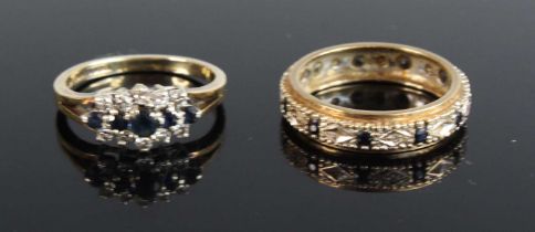 A modern 9ct gold sapphire and diamond dress ring arranged as 5 graduated round cut sapphires,