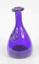 A Scandinavian(?) Bristol blue glass decanter, of mallet shape, having applied mask roundel, h.22cm