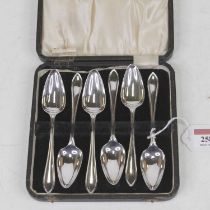 A set of six mid-20th century silver grapefruit spoons, in fitted leather case (case a/f)