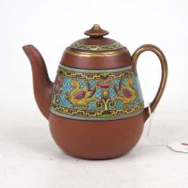 Attributed to Dr Christopher Dresser for Watcombe Pottery - a terracotta teapot and cover, the