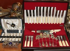 A stainless steel and silver plated 12-place setting canteen of cutlery together with a set of six