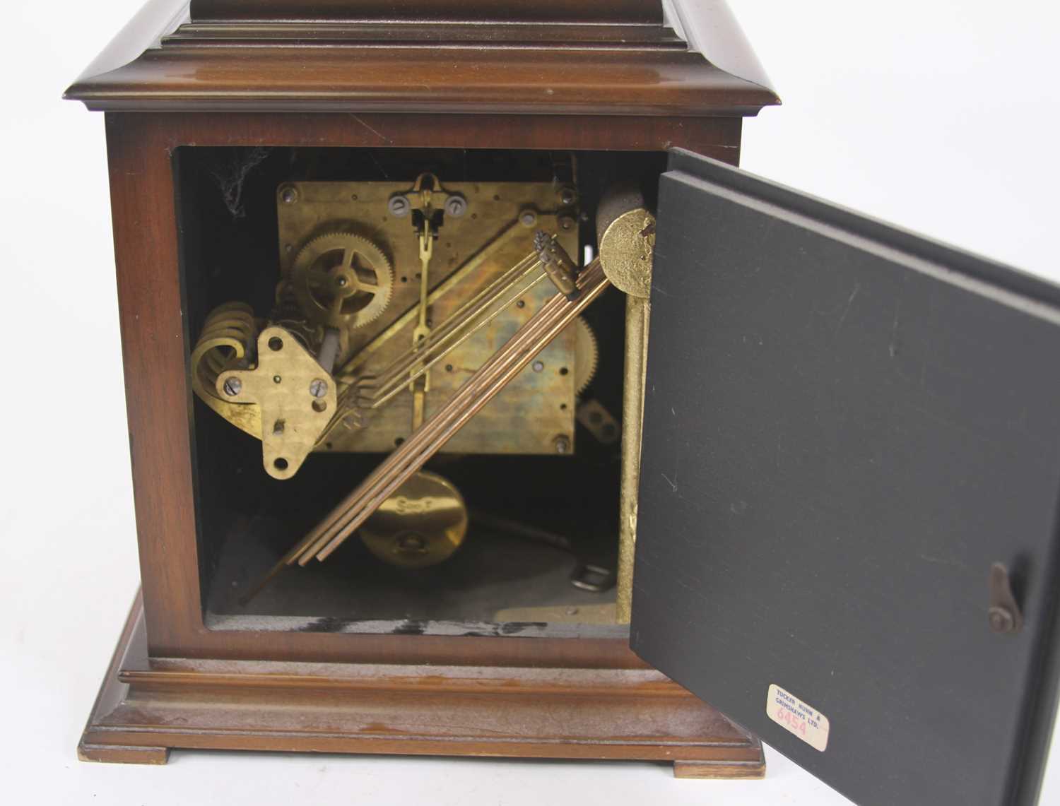 A walnut cased bracket clock in the 18th century style having a silvered chapter ring with Roman - Image 2 of 2