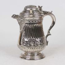 A 19th century silver plated jug, the domed cover with raised thumbpiece, having repousse floral