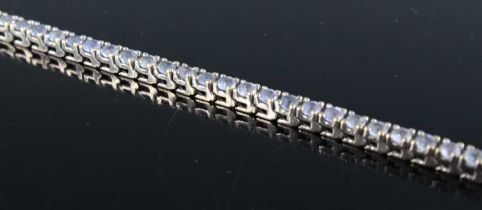 A contemporary white metal and paste set tennis bracelet, marked Ash, 9.6g, valued as silver, 18.