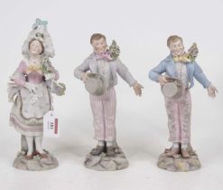 A pair of early 20th century continental bisque porcelain figures, the gentleman in standing pose