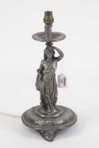 An Art Nouveau figural table candlestick, the single sconce supported by a robed maiden with