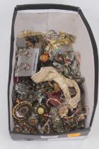 A box of miscellaneous costume jewellery, to include a gilt metal brooch of oval form inlaid with