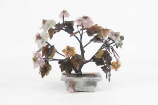 A Chinese table ornament in the form of a flowering tree, the leaves and petals being polished