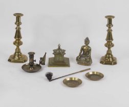 A small collection of brassware, to include a pair of candlesticks, desk stand, chamberstick,