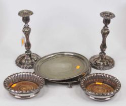 A pair of 19th century Old Sheffield plate table candlesticks, each having a silver sconce to a
