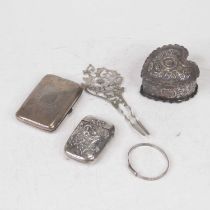 An Art Nouveau sterling silver vesta, of rounded rectangular form, embossed with a lady within
