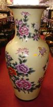 A large Chinese yellow glazed floor vase of inverse baluster form, enamel decorated with flowers,