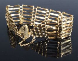 A modern 9ct gold gatelink bracelet, with heart shaped padlock clasp and safety chain, 15.1g, 18cm