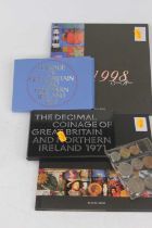A Royal Mail 1997 stamp album together with one other from 1998, two Coinage of Great Britain &