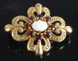 A 9ct yellow gold, opal and garnet Celtic style brooch, having a centre cluster of an oval