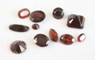 A collection of loose vari-cut garnets, the smallest round measuring approx 4.49 x 2.8mm and