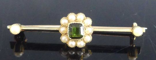 A yellow metal tourmaline and pearl cluster style bar brooch, featuring a rectangular green