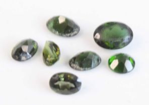 A collection of loose vari-cut green tourmaline stones, the smallest approx 7.05 x 5.05 x 3.35mm and