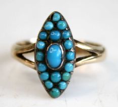 A late Victorian yellow metal turquoise navette shaped cluster ring, featuring a centre oval 4.55