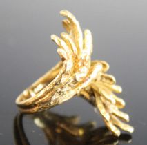 A yellow metal heavy abstract crossover style ring, with textured multi-strands, size approx N,