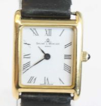 A lady's 18ct yellow gold Baume & Mercier quartz wristwatch, with rectangular white Roman dial,