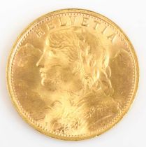 Switzerland, 1935 gold 20 francs, obv; female bust with garland of flowers before mountains, rev;