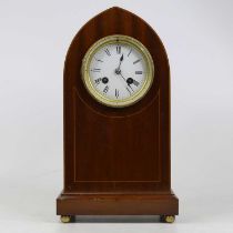 An Edwardian mahogany and pearwood strung lancet shaped mantel clock, having an enamelled dial