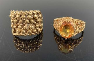 A 9ct gold signet type ring with knobbled head, size O, together with a yellow metal and citrine set