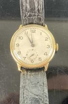 A vintage gent's 9ct gold cased manual wind wristwatch having Swiss 15 jewel movement, and in