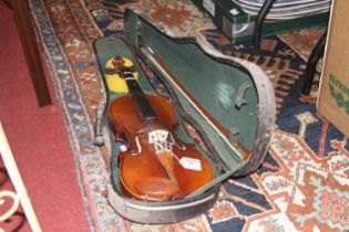 A Chinese Republic student's violin having a two piece back, ebony fingerboard, and turned wooden