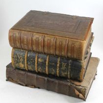 A Victorian brown embossed leather bound and brass mounted family bible, together with two others