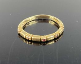 A 14ct gold and ruby point set half hoop ring, 1.9g, size L