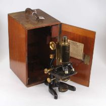 A 20th century lacquered brass and iron 'Bactil' monocular microscope, with Plano-Concave mirror,