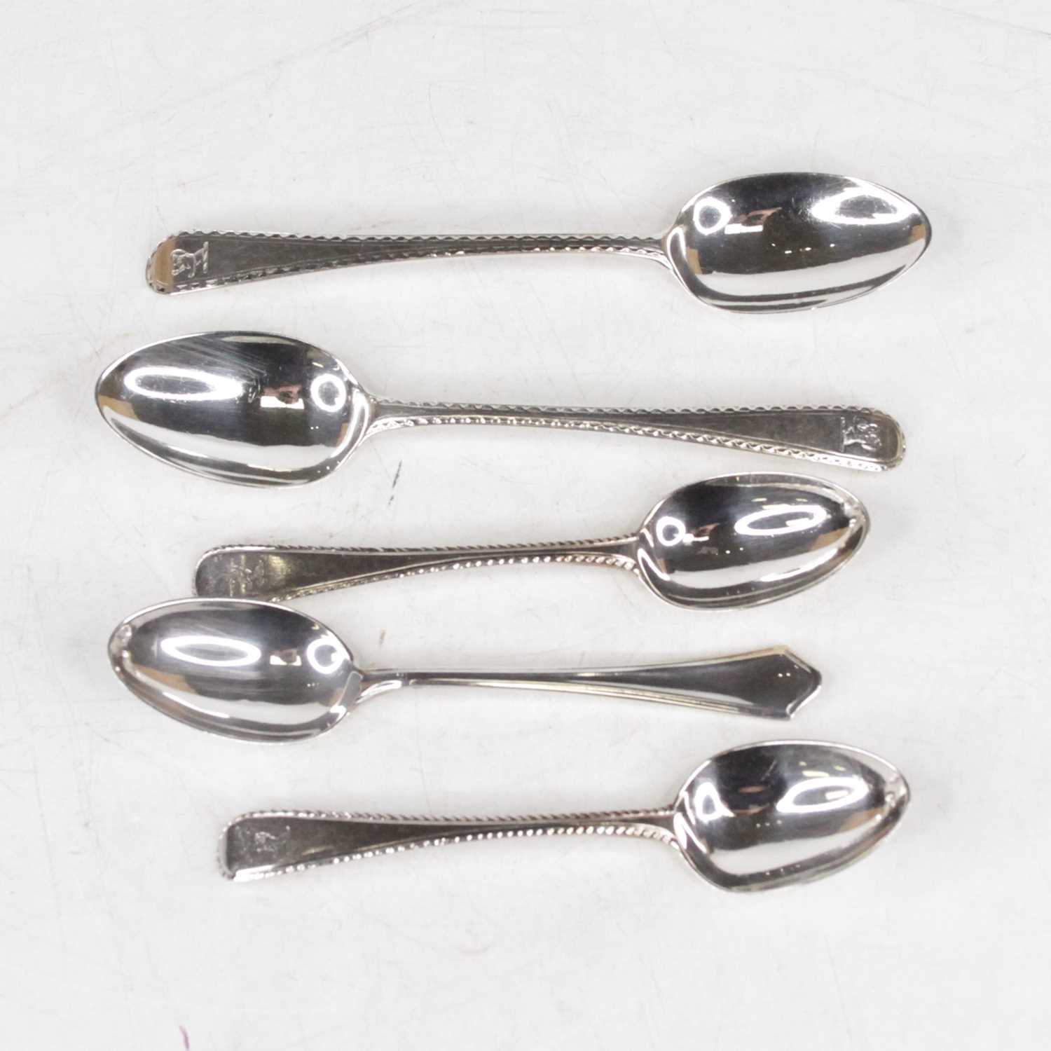 A pair of Victorian silver teaspoons in the Old English Bead pattern; together with two similar