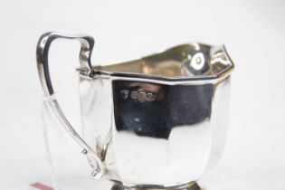 A George V silver milk jug, of decagonal form, with engraved monogram, 4.1oz