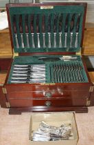 An early 20th century mahogany cased canteen of silver plated cutlery, the hinged lid opening to