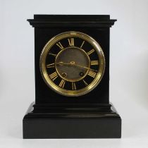 A Victorian black slate cased mantel clock, the slate chapter ring with incised gilt painted Roman