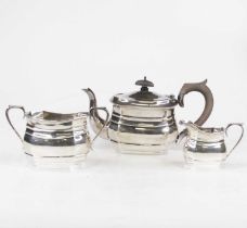 A George V silver harlequin three-piece bachelors tea service, of bombe form, the teapot with