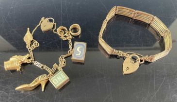 A 9ct gold bracelet containing assorted gilt metal and gold charms, gross weight 17.1g, a gilt metal